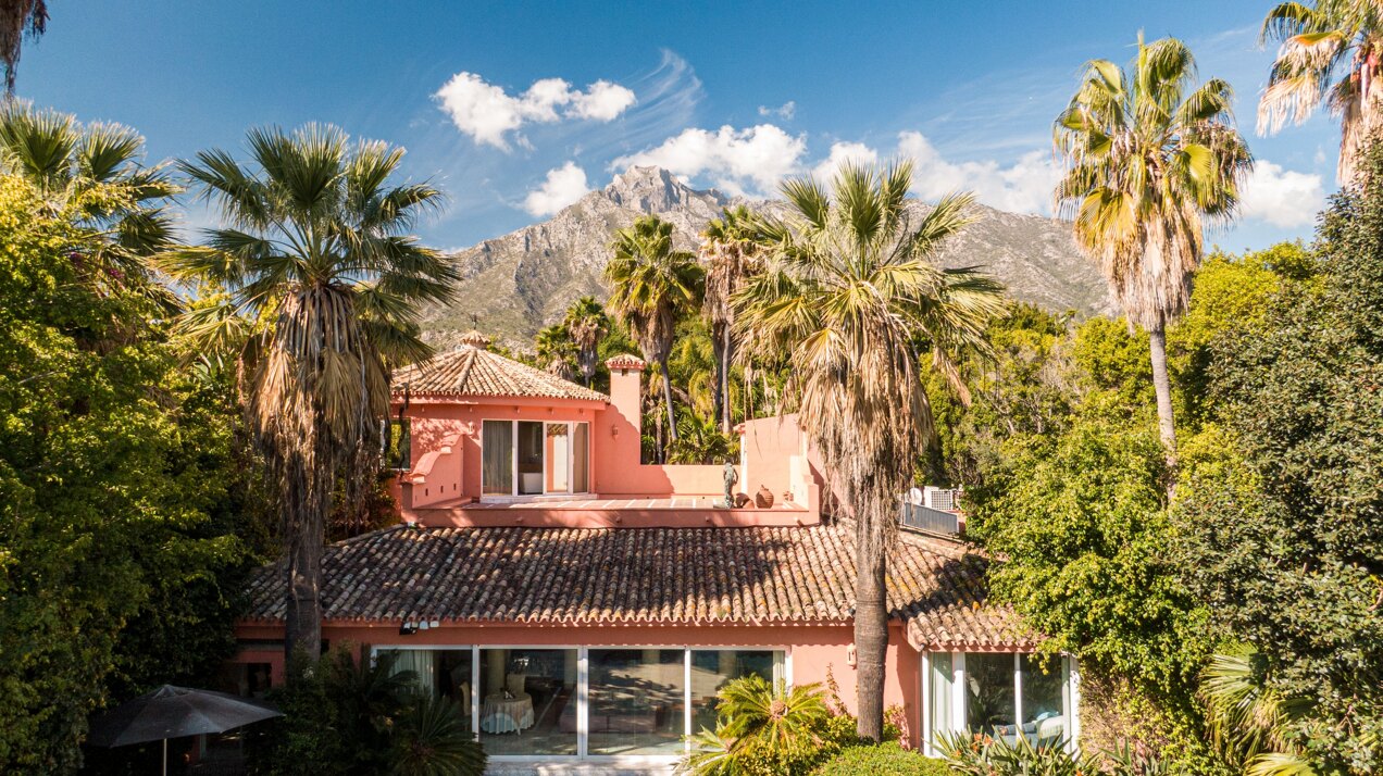 Secluded stately mansion languishes amidst subtropical gardens in the heart of Marbella.