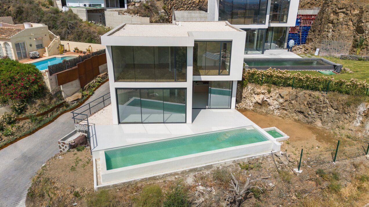 Chic new villa in a desirable gated community is a superb opportunity to live in luxury and elegance