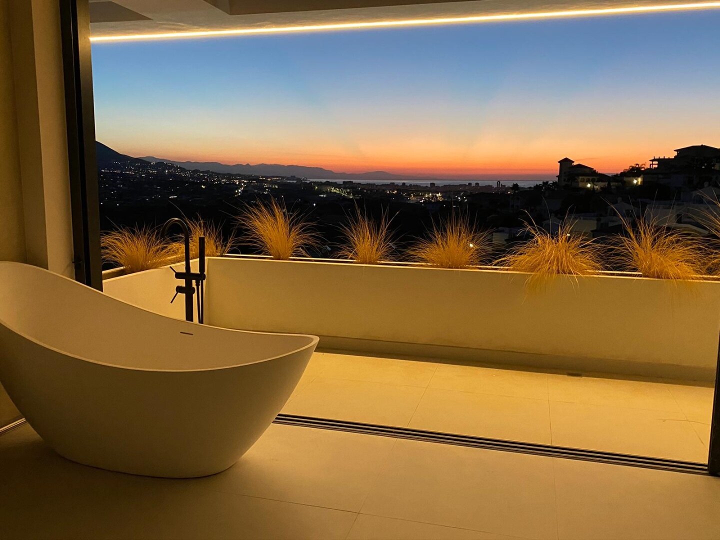 A meticulously designed new villa that embodies modern luxury, offers breathtaking views & privacy.
