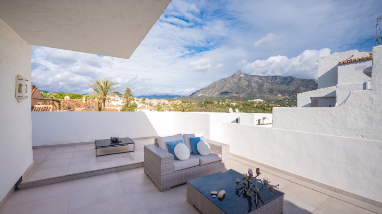 Stunning Marbella penthouse exudes elegance from its prime location within elite gated community.