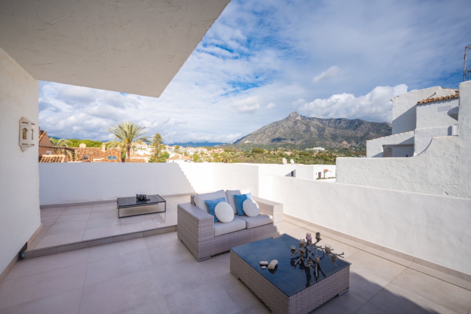 Stunning Marbella penthouse exudes elegance from its prime location within elite gated community.