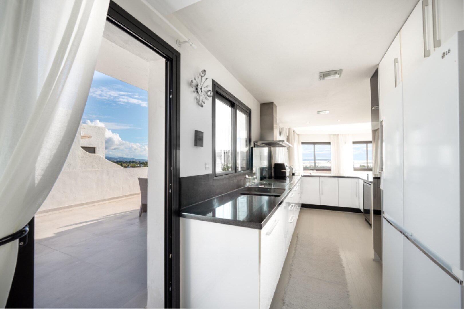 Stunning Marbella penthouse exudes elegance from its prime location within elite gated community.