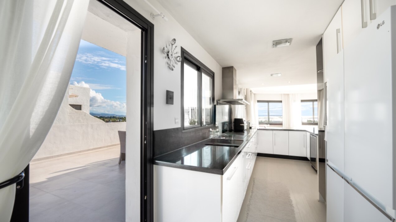 Stunning Marbella penthouse exudes elegance from its prime location within elite gated community.