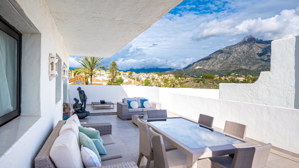 Stunning Marbella penthouse exudes elegance from its prime location within elite gated community.
