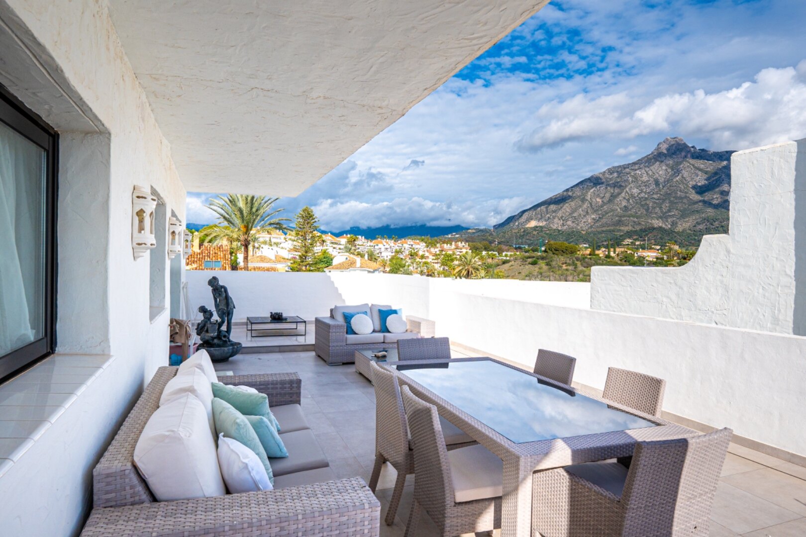 Stunning Marbella penthouse exudes elegance from its prime location within elite gated community.