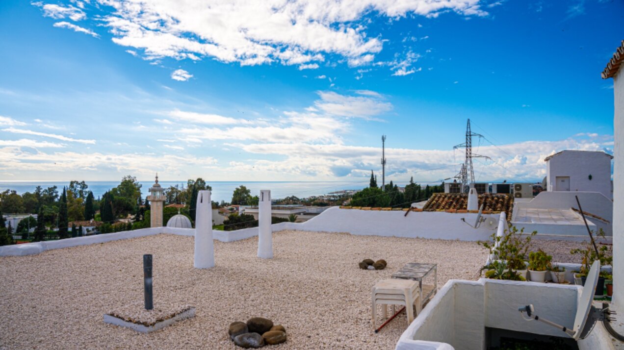 Stunning Marbella penthouse exudes elegance from its prime location within elite gated community.