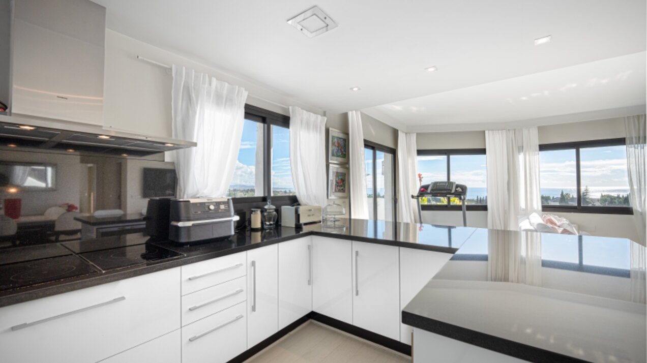 Stunning Marbella penthouse exudes elegance from its prime location within elite gated community.