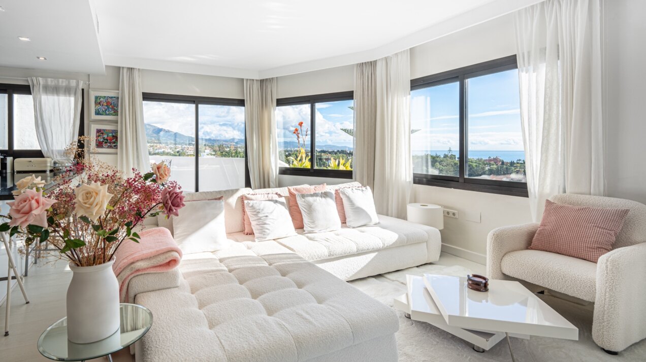 Stunning Marbella penthouse exudes elegance from its prime location within elite gated community.