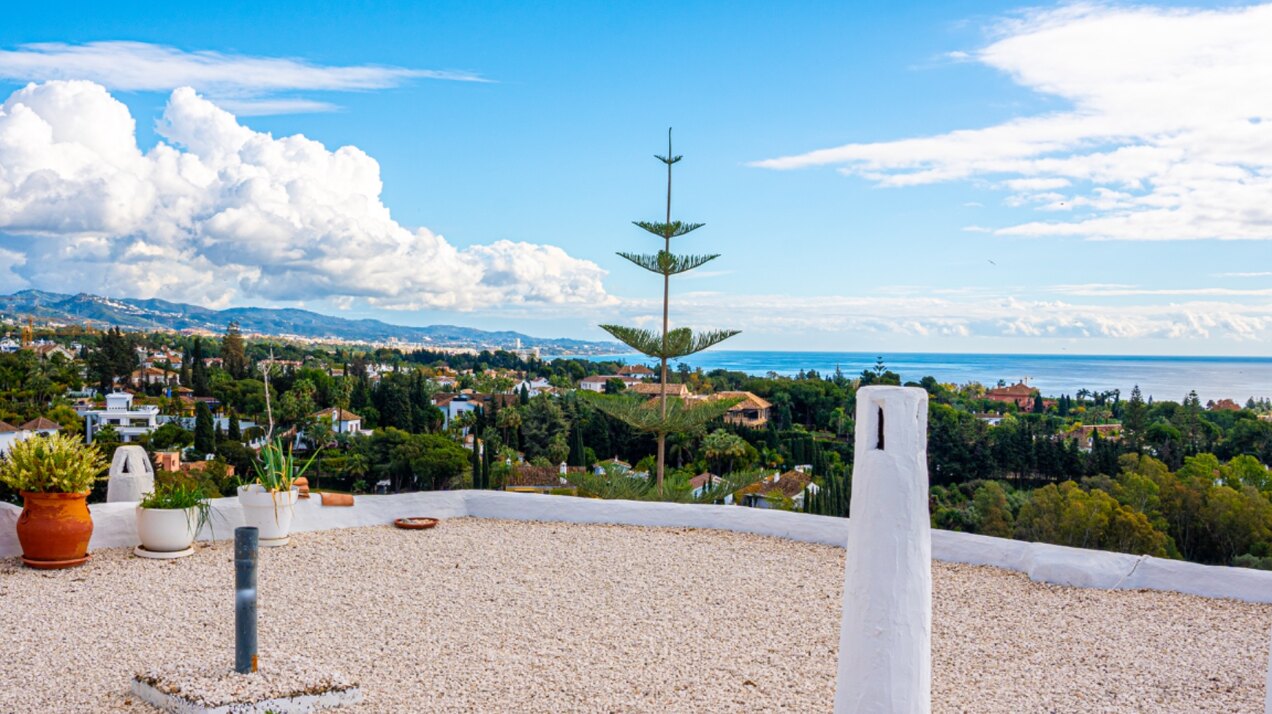 Stunning Marbella penthouse exudes elegance from its prime location within elite gated community.