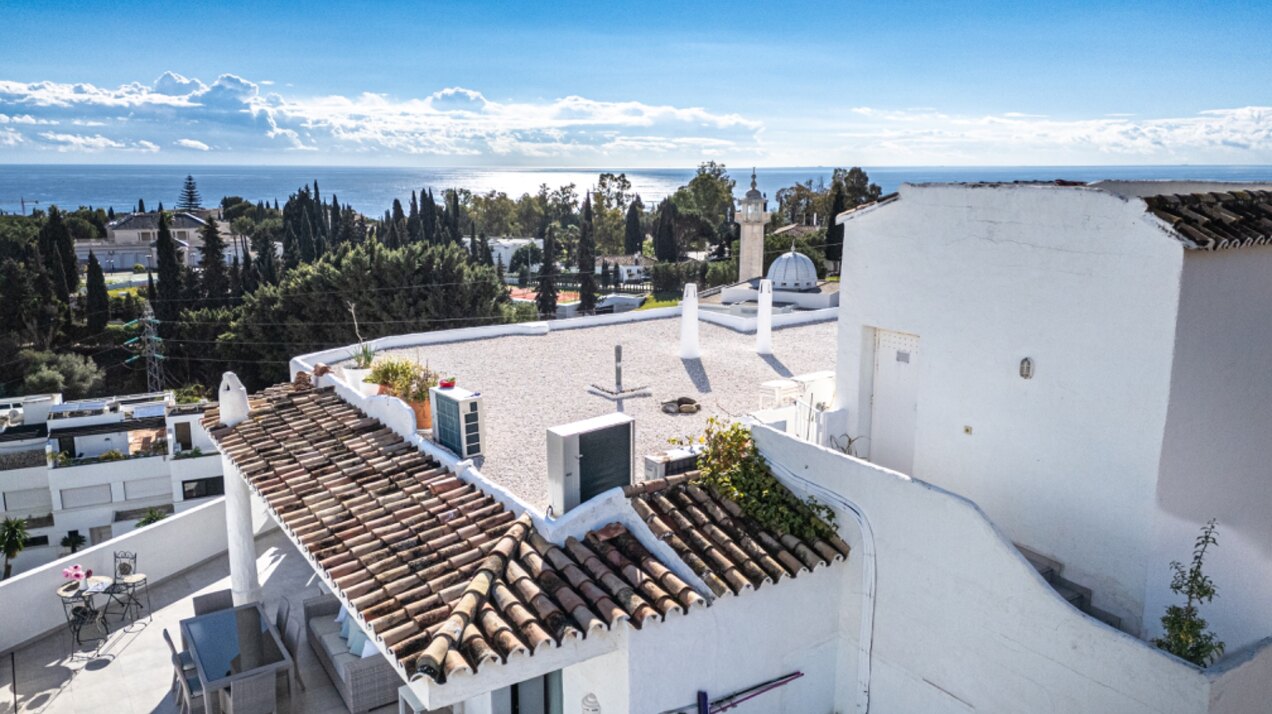 Stunning Marbella penthouse exudes elegance from its prime location within elite gated community.