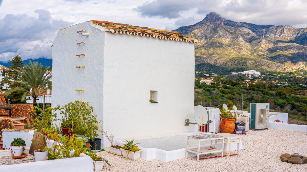 Stunning Marbella penthouse exudes elegance from its prime location within elite gated community.
