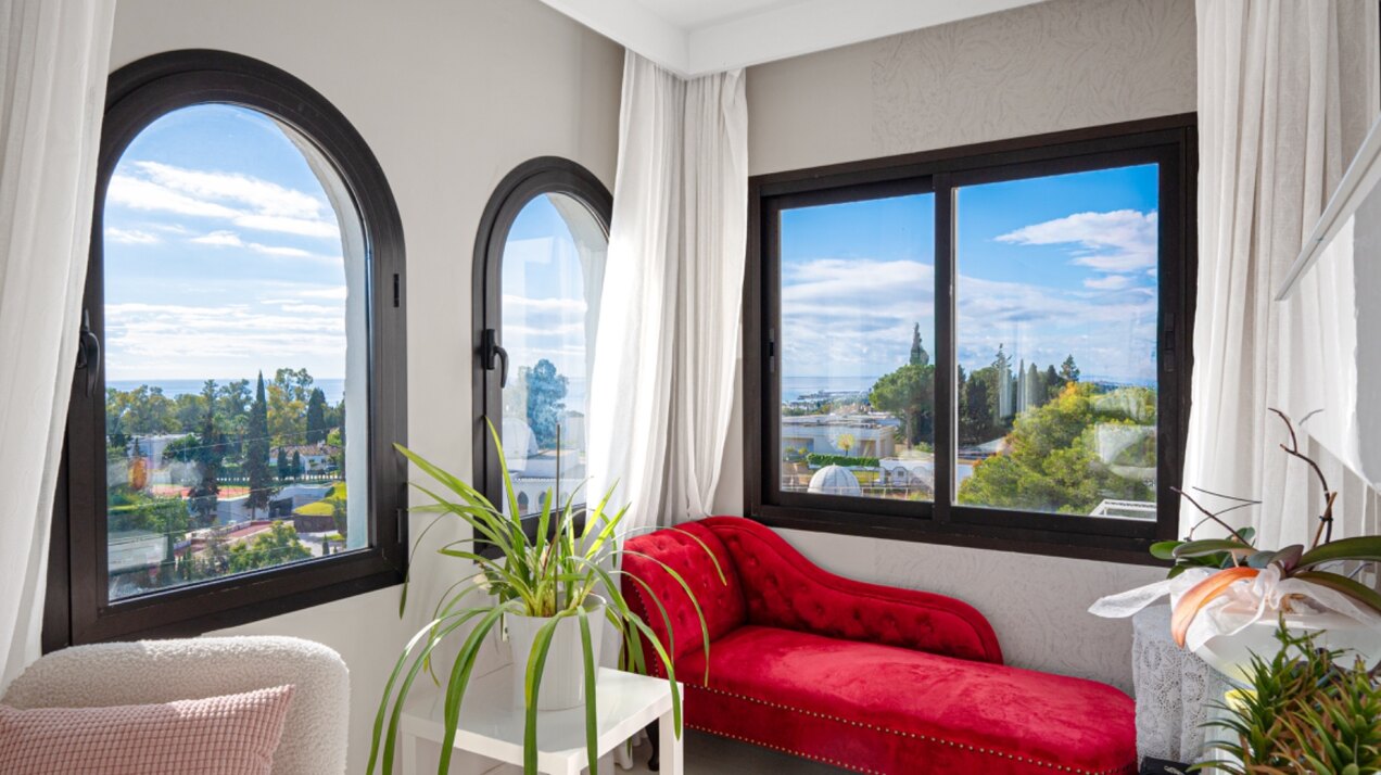 Stunning Marbella penthouse exudes elegance from its prime location within elite gated community.