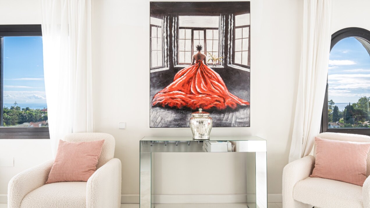 Stunning Marbella penthouse exudes elegance from its prime location within elite gated community.