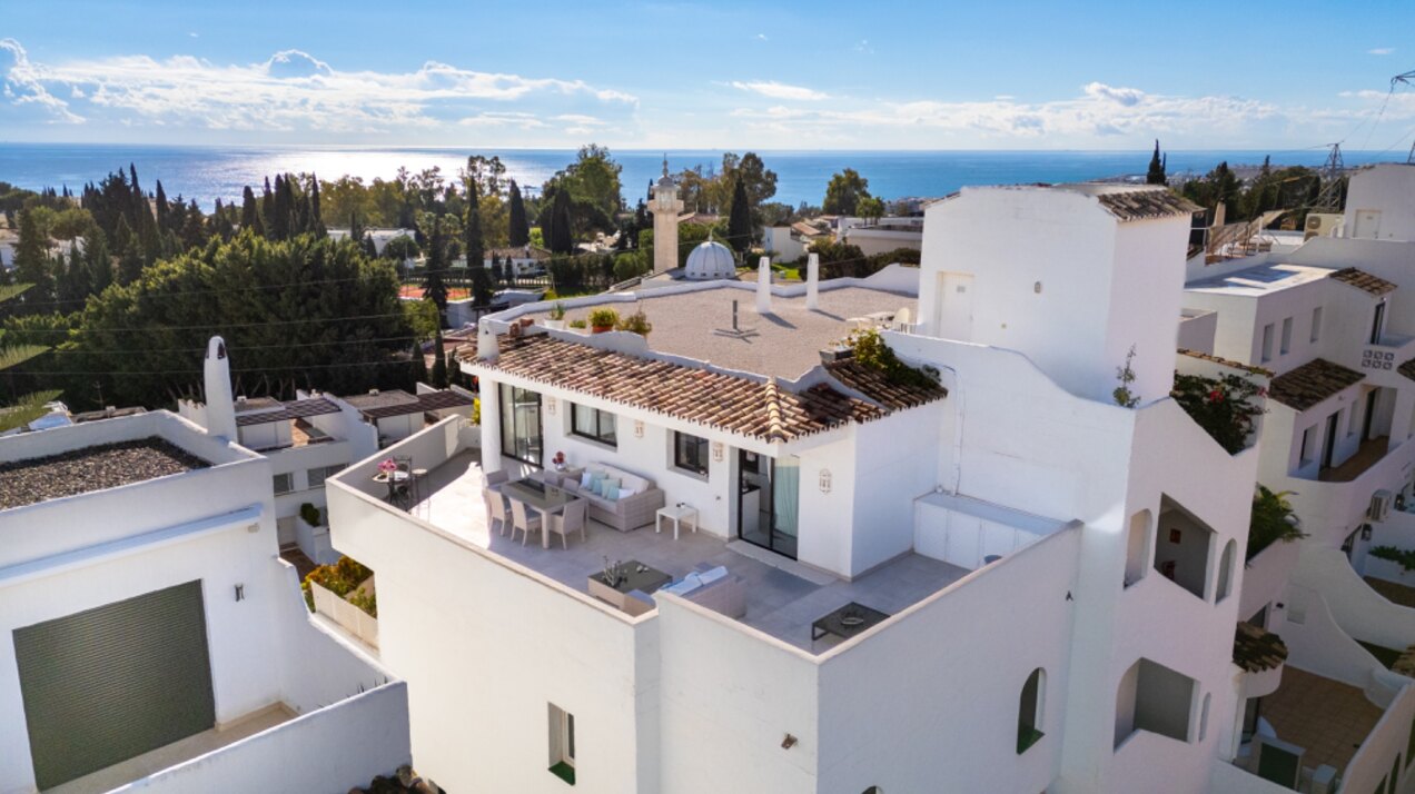 Stunning Marbella penthouse exudes elegance from its prime location within elite gated community.