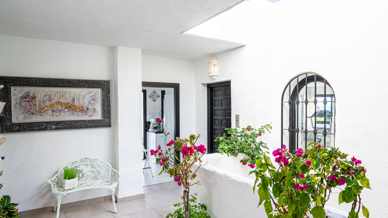 Stunning Marbella penthouse exudes elegance from its prime location within elite gated community.