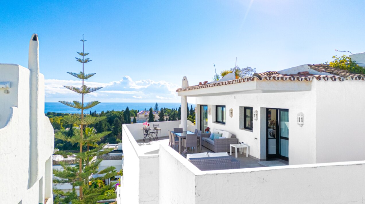 Stunning Marbella penthouse exudes elegance from its prime location within elite gated community.
