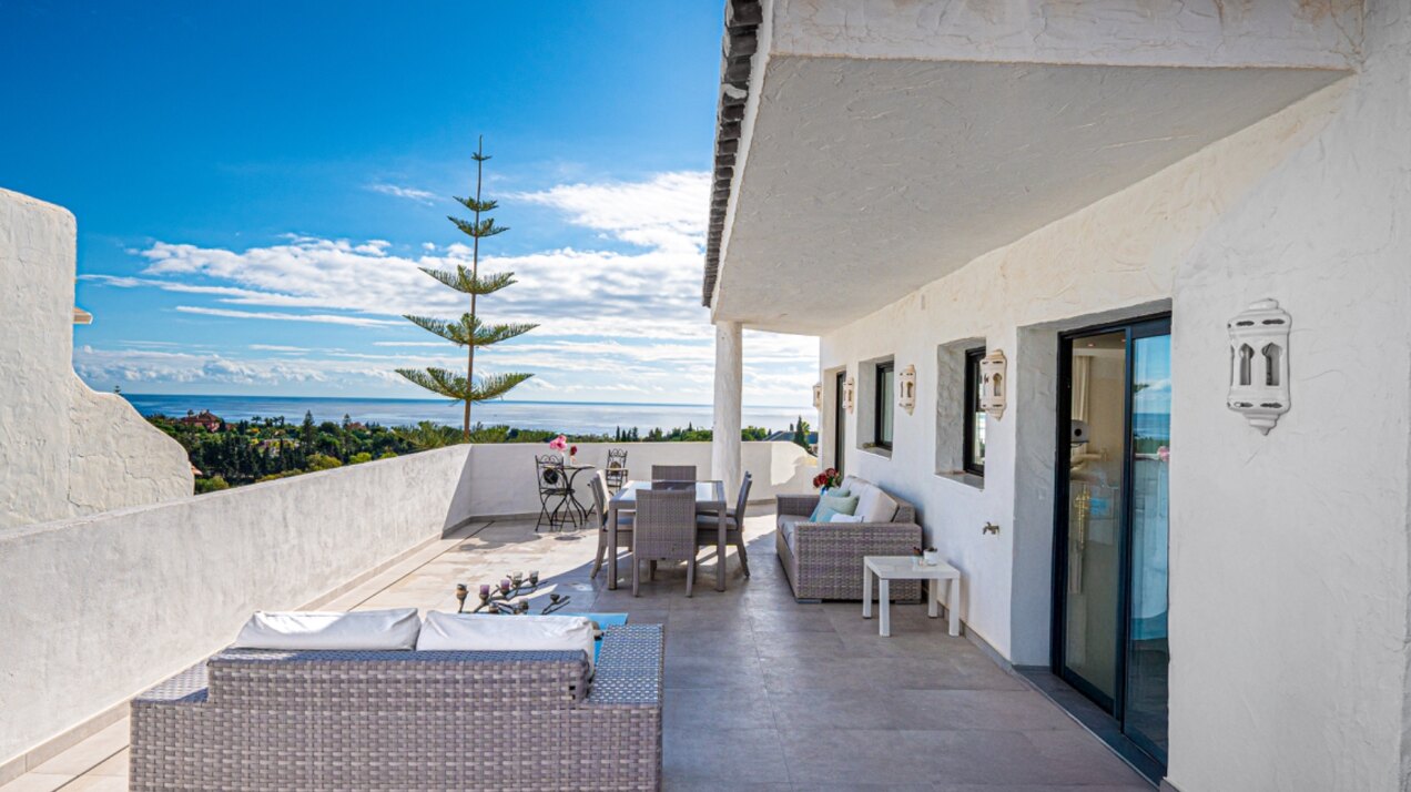 Stunning Marbella penthouse exudes elegance from its prime location within elite gated community.