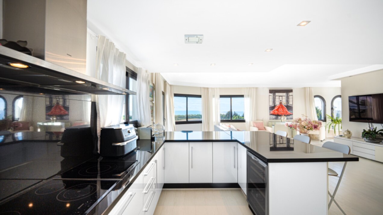 Stunning Marbella penthouse exudes elegance from its prime location within elite gated community.