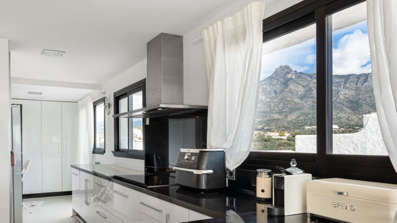 Stunning Marbella penthouse exudes elegance from its prime location within elite gated community.