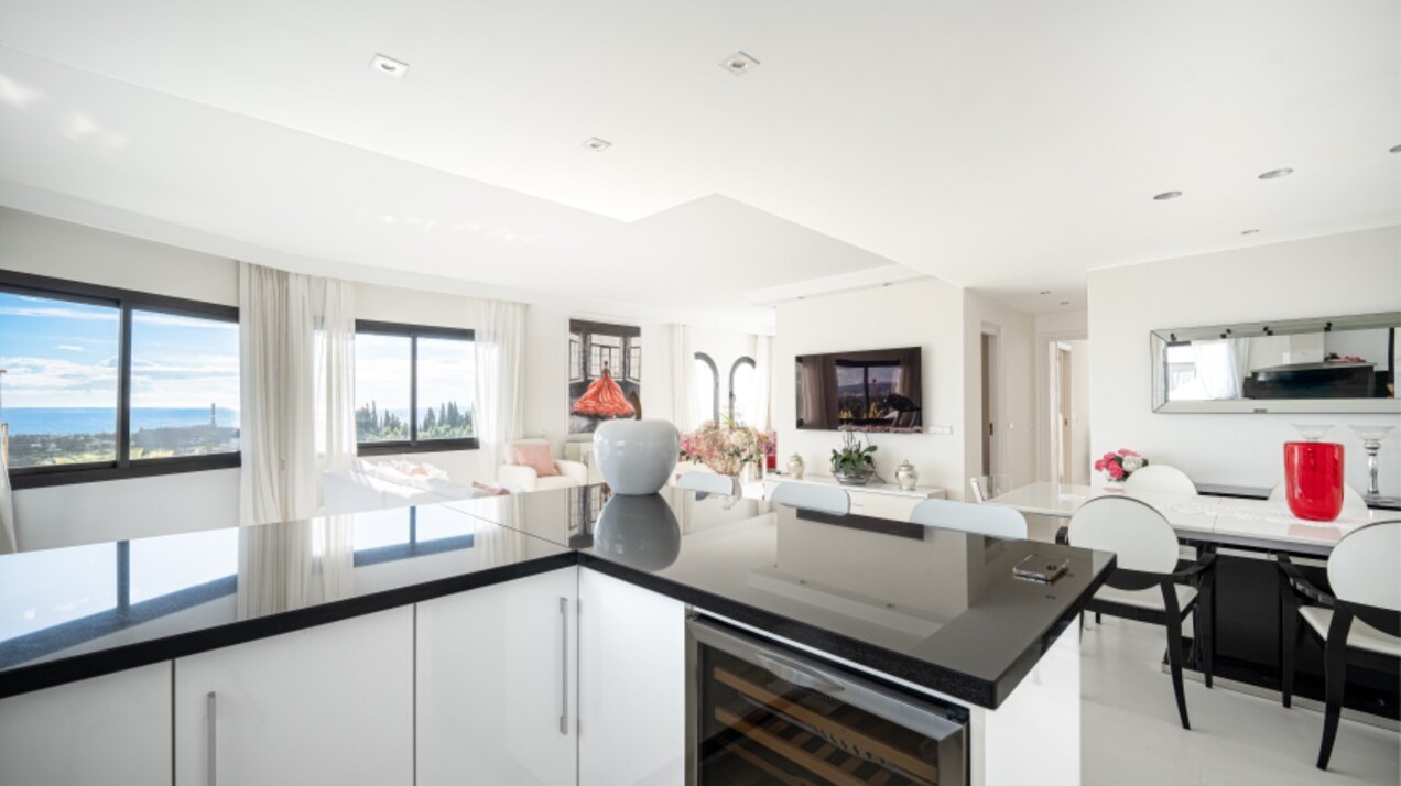 Stunning Marbella penthouse exudes elegance from its prime location within elite gated community.
