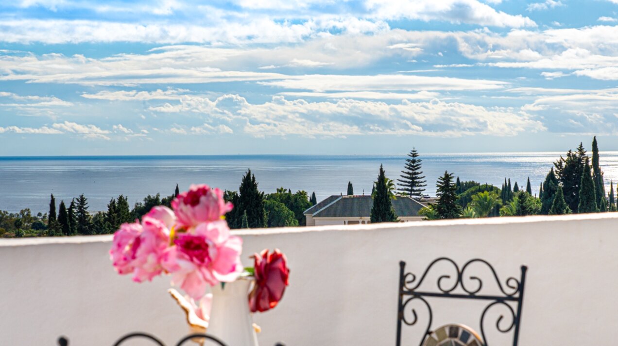 Stunning Marbella penthouse exudes elegance from its prime location within elite gated community.