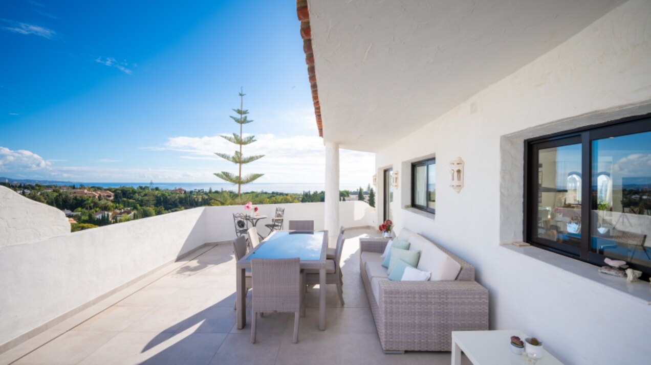 Stunning Marbella penthouse exudes elegance from its prime location within elite gated community.