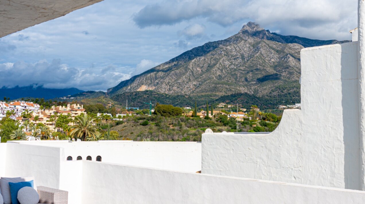 Stunning Marbella penthouse exudes elegance from its prime location within elite gated community.