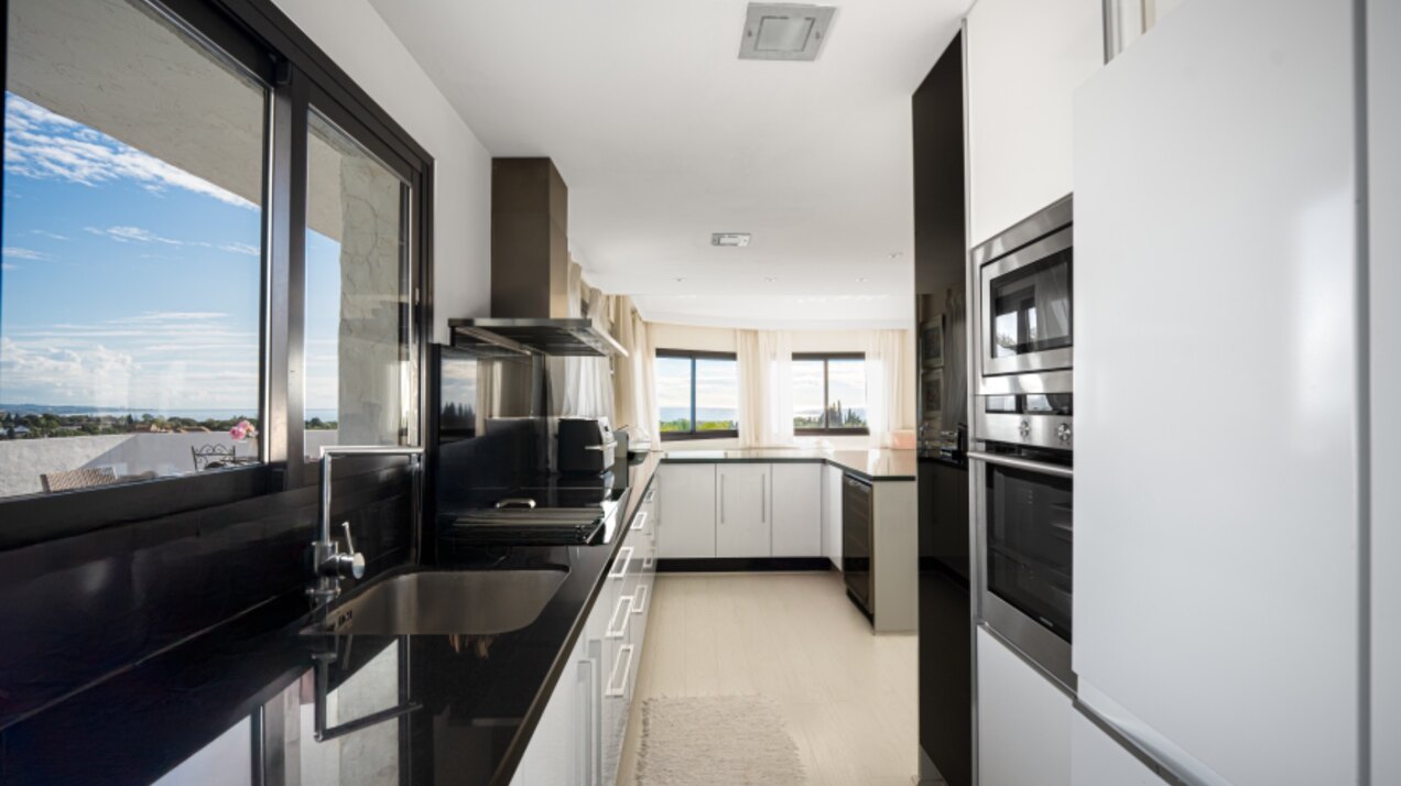 Stunning Marbella penthouse exudes elegance from its prime location within elite gated community.