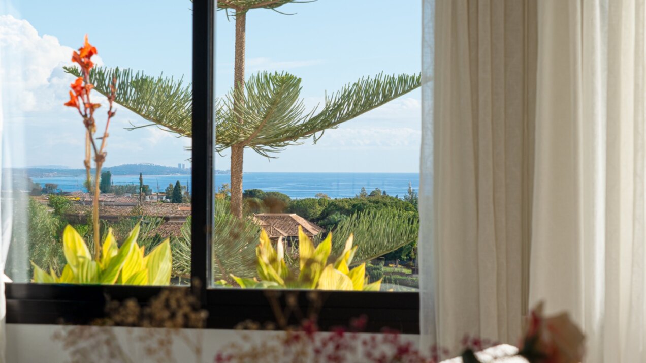 Stunning Marbella penthouse exudes elegance from its prime location within elite gated community.