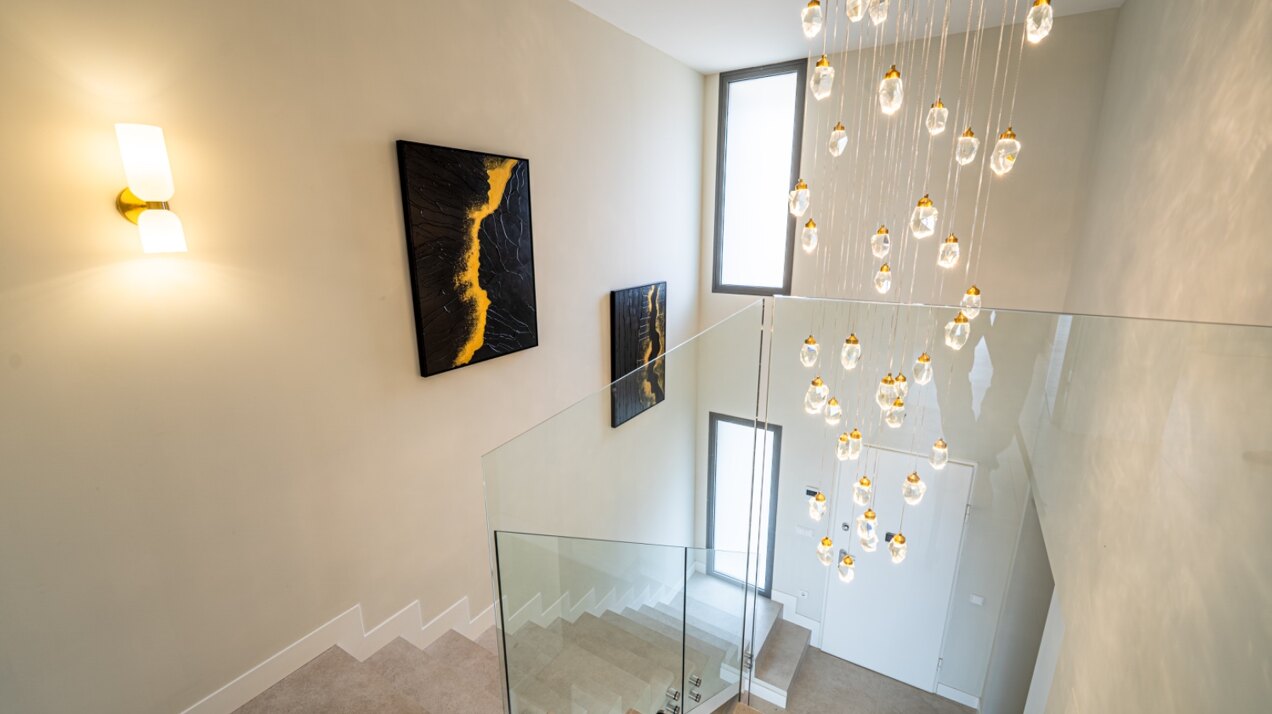Walking distance to the beach and golf, this elegant townhouse will captivate and enthrall