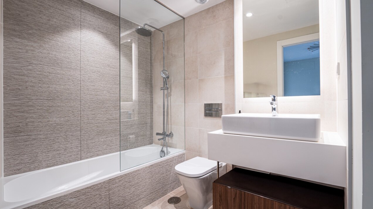Walking distance to the beach and golf, this elegant townhouse will captivate and enthrall