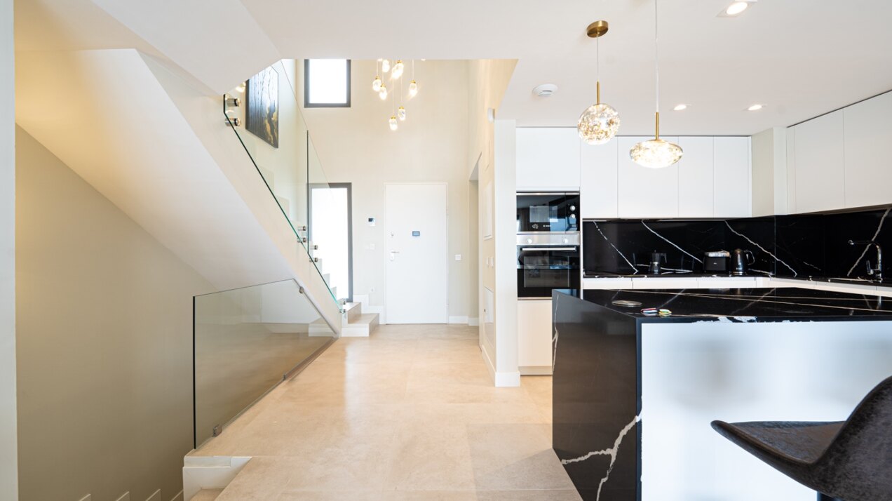 Walking distance to the beach and golf, this elegant townhouse will captivate and enthrall
