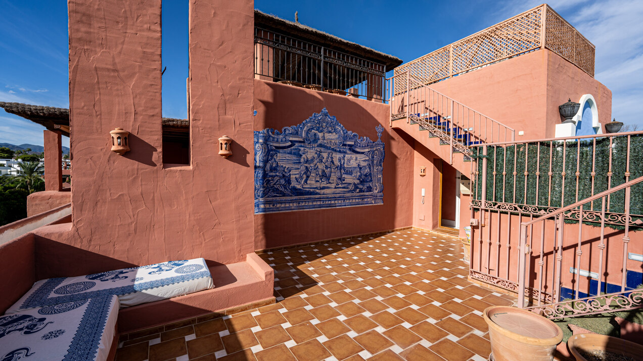 Palatial duplex penthouse sits atop its throne in one of Esteponas most exclusive gate communities