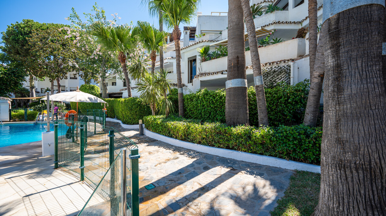 Ground floor beachfront apartment in stylish gated community is a great investment opportunity!