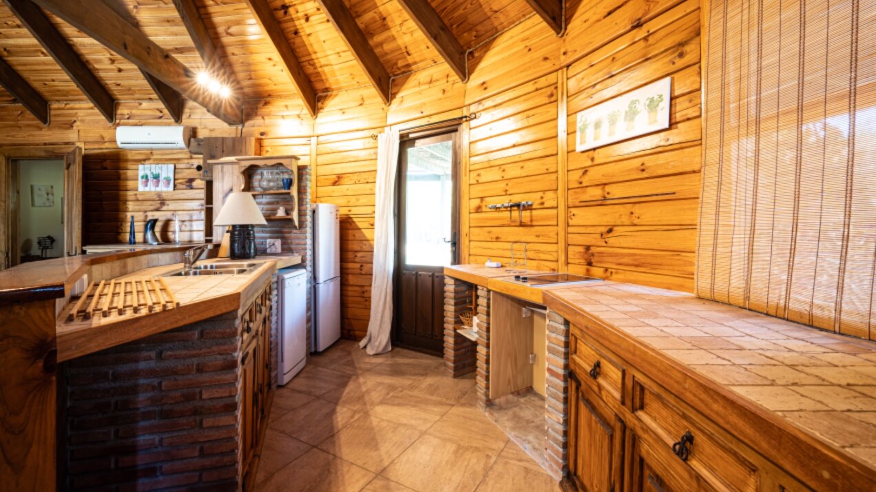 Stunning wooden country finca sits on the outskirts of Monda and its historic castle