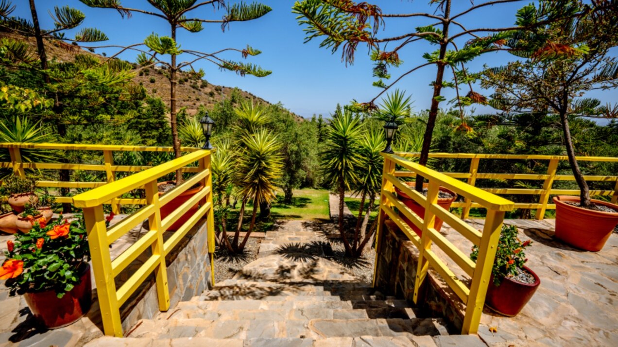 Stunning wooden country finca sits on the outskirts of Monda and its historic castle