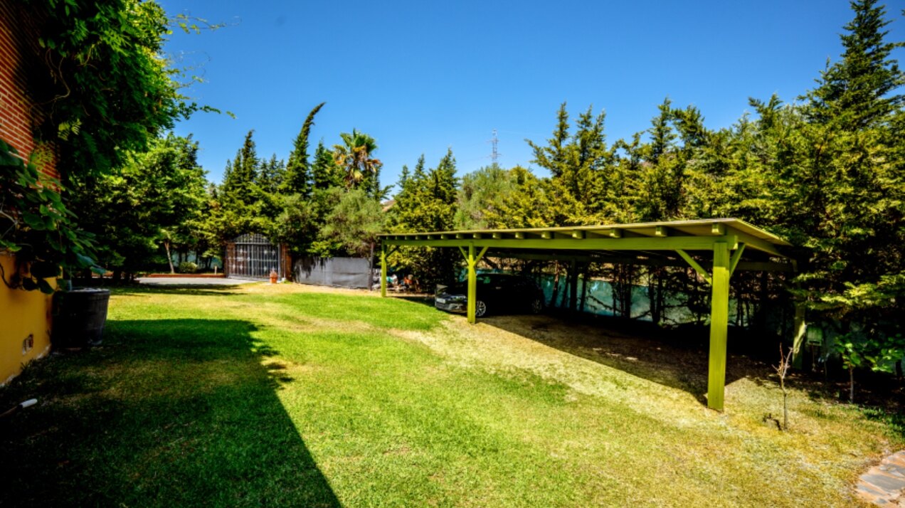 Stunning wooden country finca sits on the outskirts of Monda and its historic castle