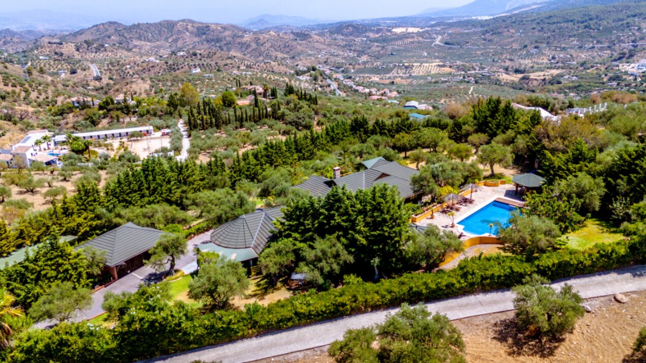 Stunning wooden country finca sits on the outskirts of Monda and its historic castle