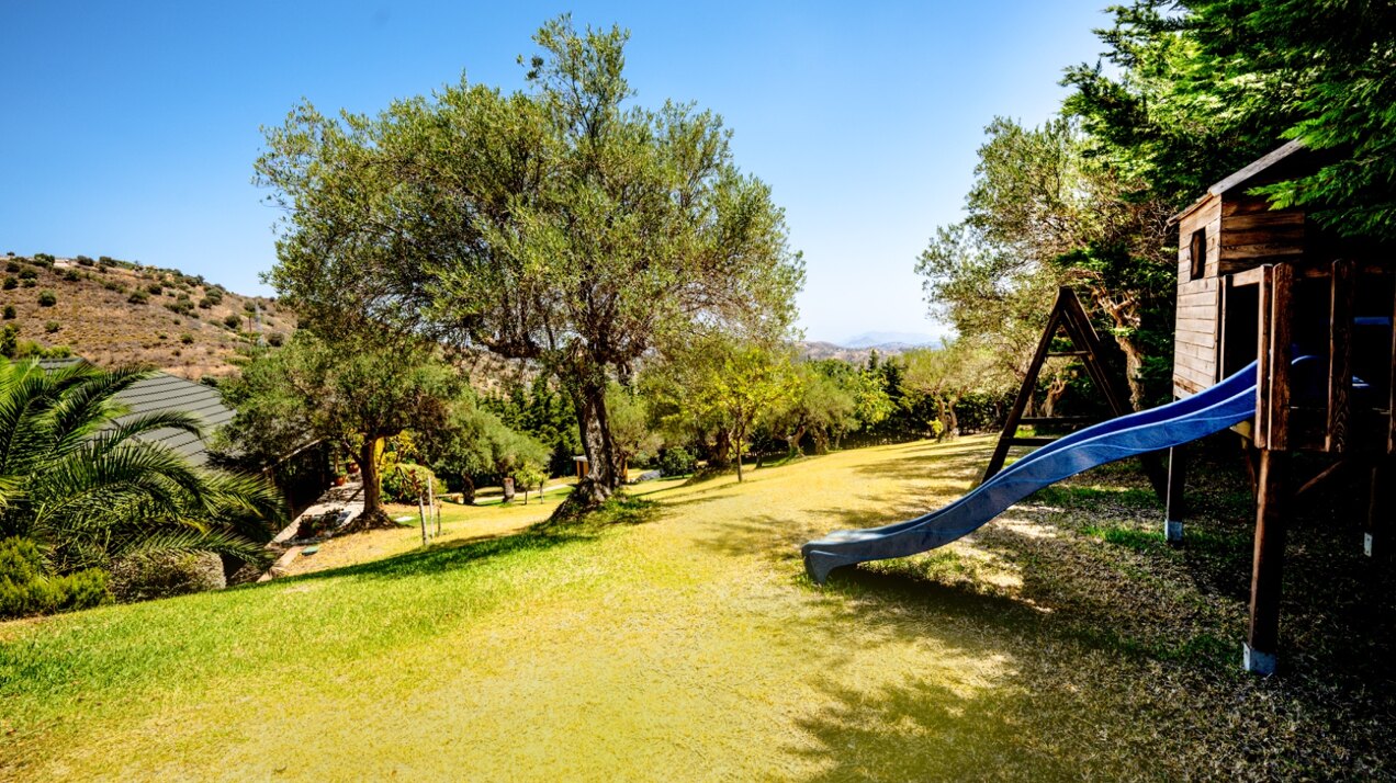 Stunning wooden country finca sits on the outskirts of Monda and its historic castle