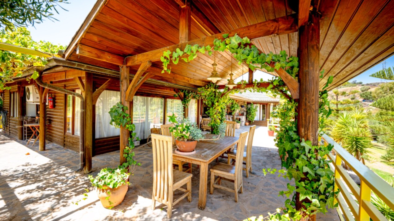 Stunning wooden country finca sits on the outskirts of Monda and its historic castle