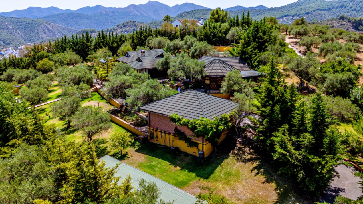Stunning wooden country finca sits on the outskirts of Monda and its historic castle
