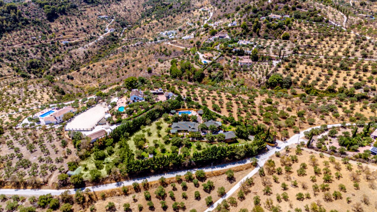 Stunning wooden country finca sits on the outskirts of Monda and its historic castle