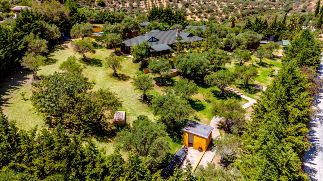Stunning wooden country finca sits on the outskirts of Monda and its historic castle