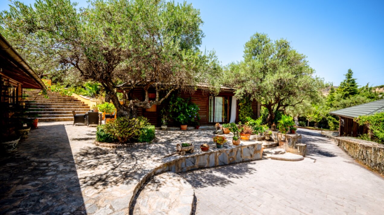Stunning wooden country finca sits on the outskirts of Monda and its historic castle