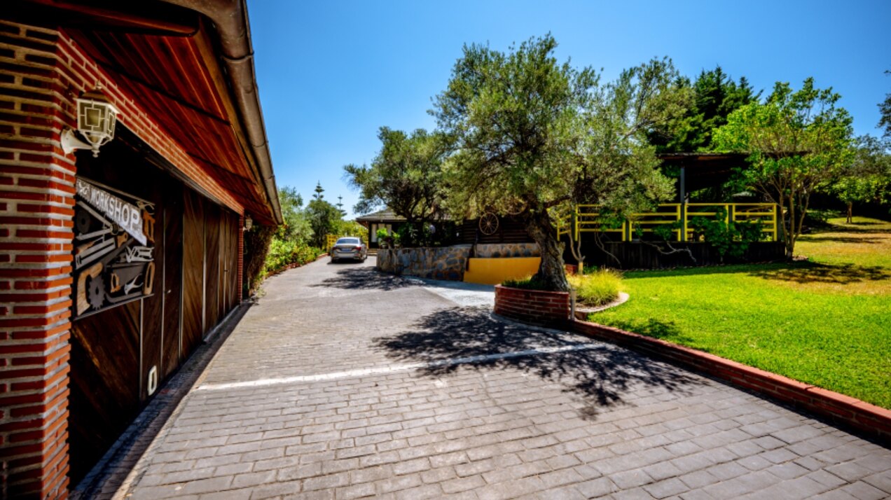 Stunning wooden country finca sits on the outskirts of Monda and its historic castle