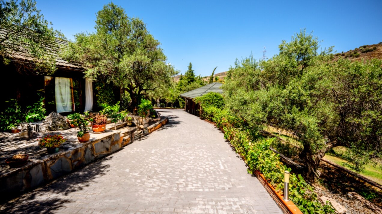 Stunning wooden country finca sits on the outskirts of Monda and its historic castle