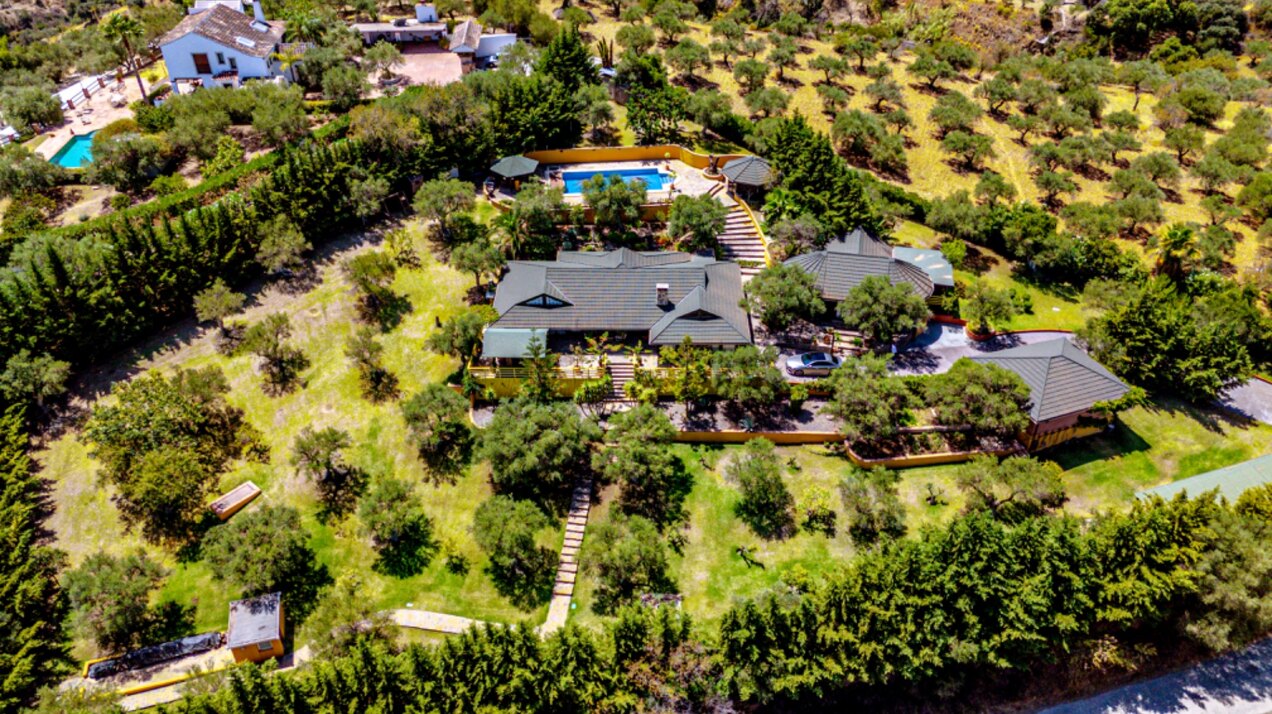 Stunning wooden country finca sits on the outskirts of Monda and its historic castle