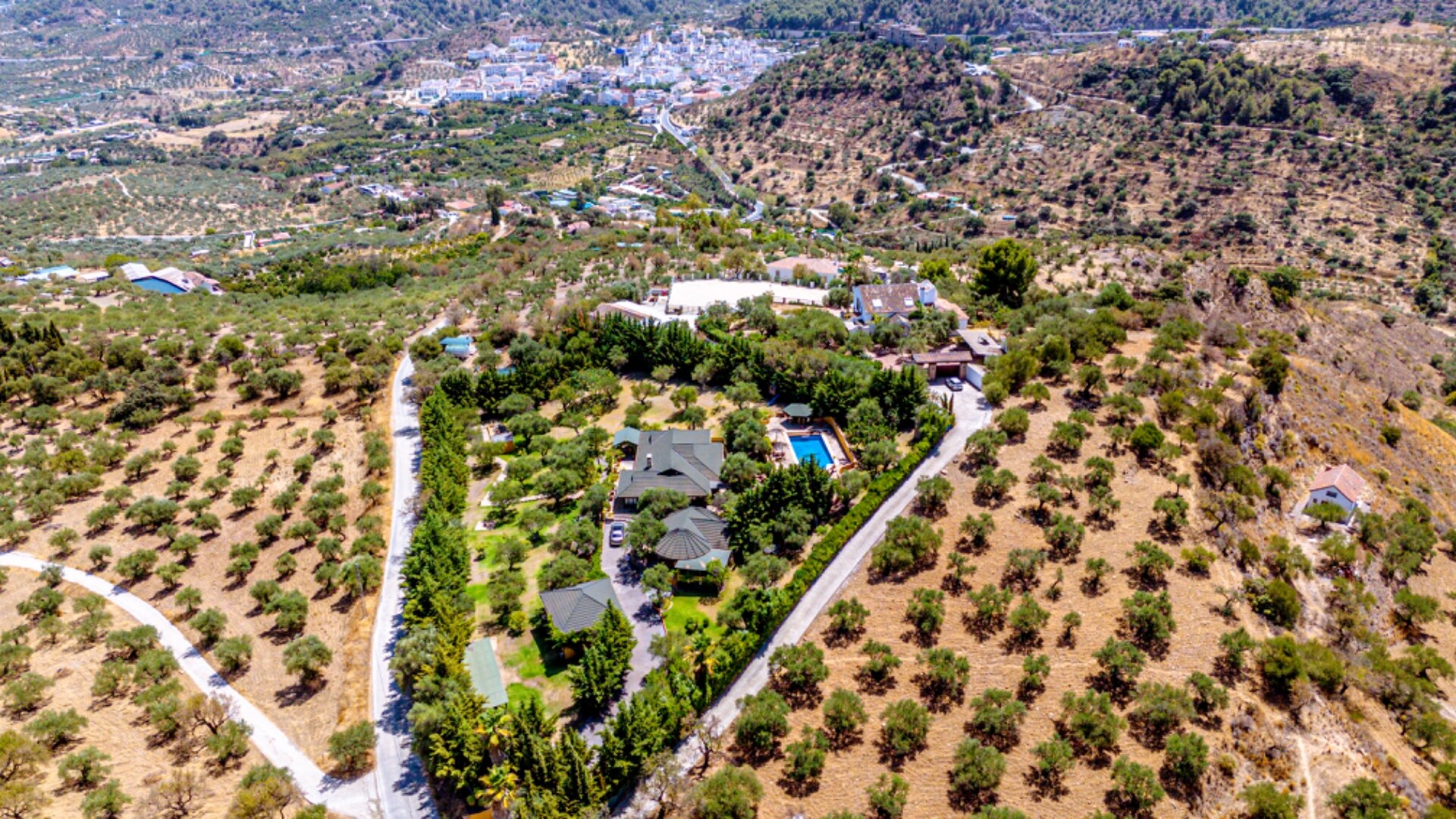 Stunning wooden country finca sits on the outskirts of Monda and its historic castle