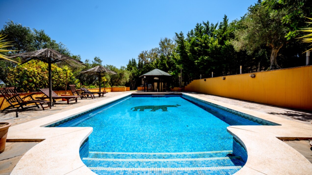 Stunning wooden country finca sits on the outskirts of Monda and its historic castle