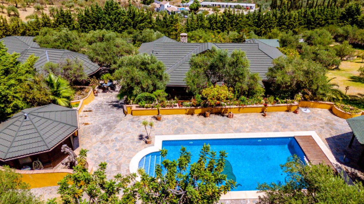 Stunning wooden country finca sits on the outskirts of Monda and its historic castle